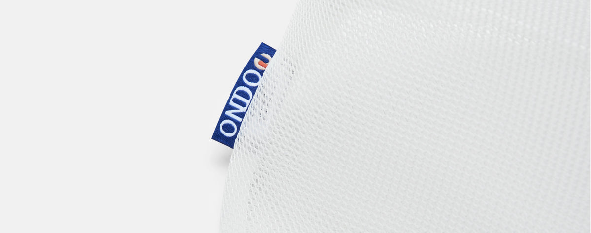 A close up of the ONDO tag on the Premium Mesh Laundry Bag