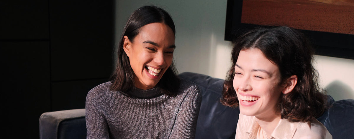Two models laughing