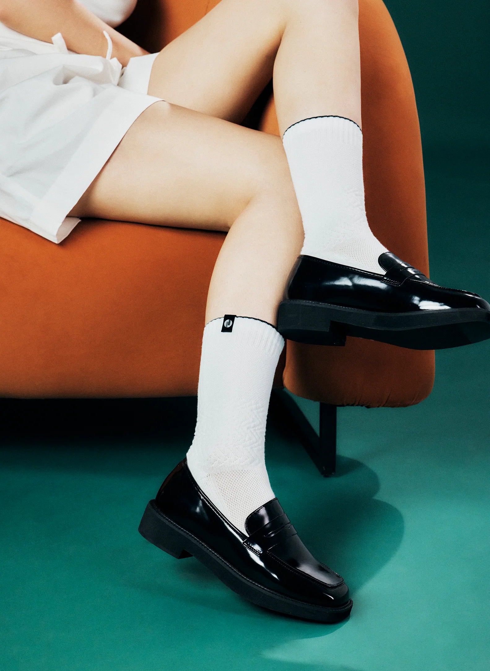 White Crew Length Socks Shown With Black Loafers