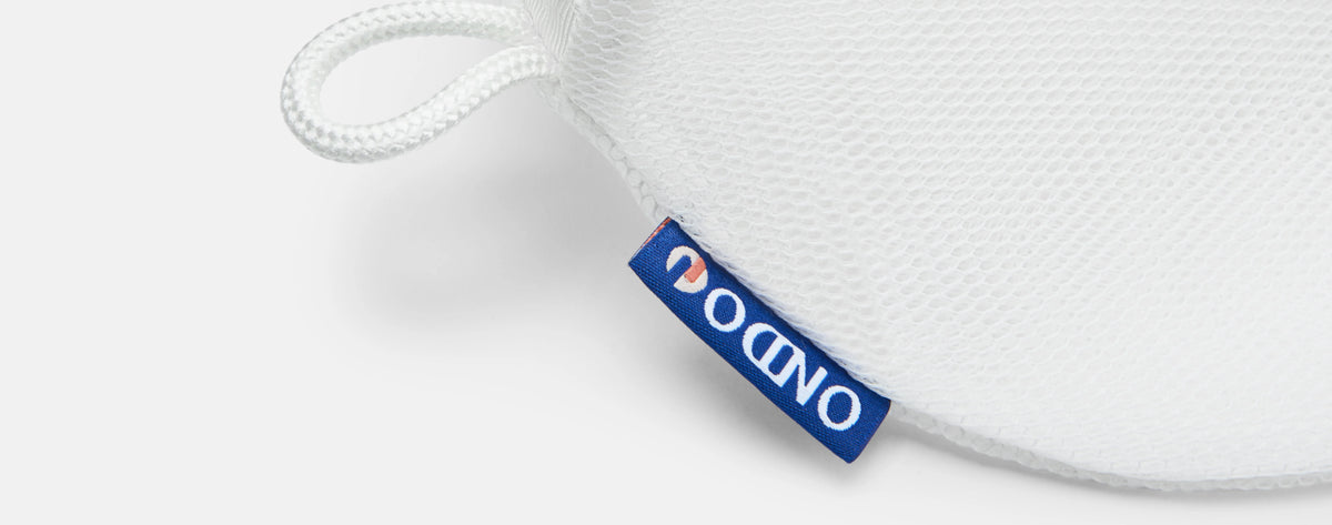 A close up of the ONDO tag on the Premium Mesh Laundry Bag